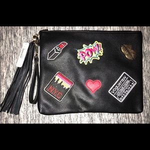 Brand new Charming Charlie “Social Patch” clutch